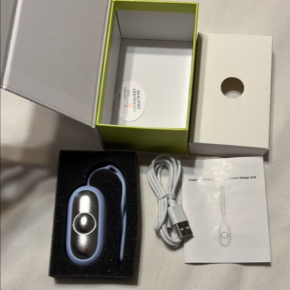 Silver and Blue Sleep Aid Device